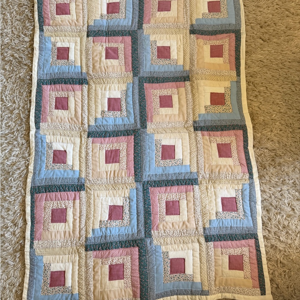 Patchwork Quilt with Blue, Pink, and Cream Accents